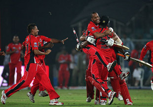 T&T players launch themselves on Kieron Pollard after their four-wicket win, New South Wales v Trinidad & Tobago, Champions League Twenty20, League A, Hyderabad, October 16, 2009