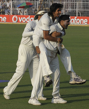 Ishant Sharma and Harbhajan Singh celebrate, India v South Africa, 2nd Test, Kolkata, 5th day, February 18, 2010