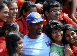 Muttiah Muralitharan with some young fans during training at the SSC, Colombo, February 11, 2011