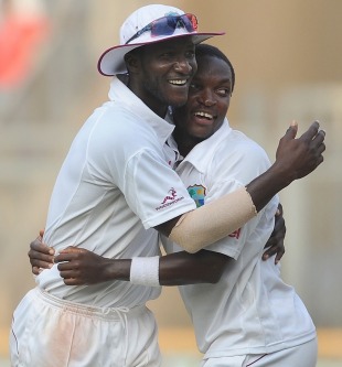 Darren Sammy and Fidel Edwards celebrate after a last-ball draw, India v West Indies, 3rd Test, Mumbai, 5th day, November 26, 2011 