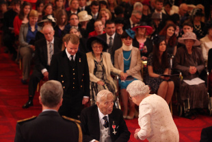Former cricketer George Chesterton receives his MBE from the Queen, London, October 19, 2012