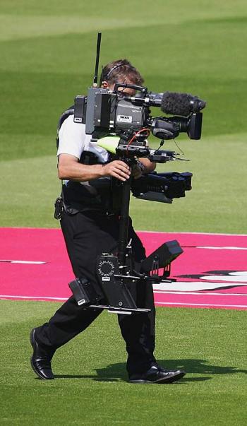 A television cameraman follows the two batsmen to the middle, England v Sri Lanka, 1st Test, Lord's, May 12, 2006