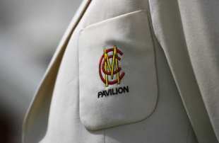 A close up of the MCC badge on a blazer pocket 